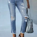 Vaqueros rasgados ajustados ligeramente elásticos a la moda para | Ropa de mujer · Omeda.es